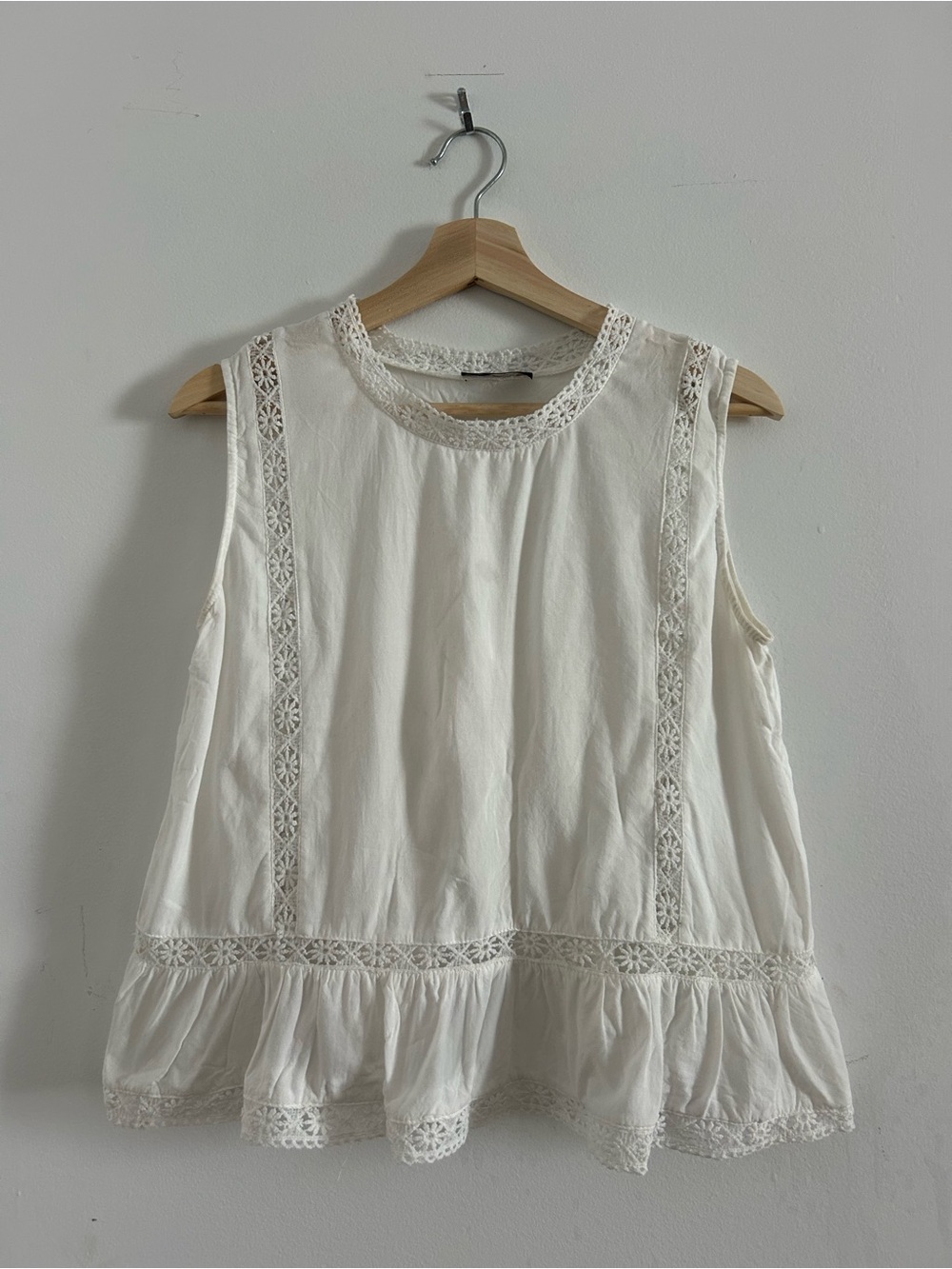 Sleeveless Lace-Trim Peplum Top in White